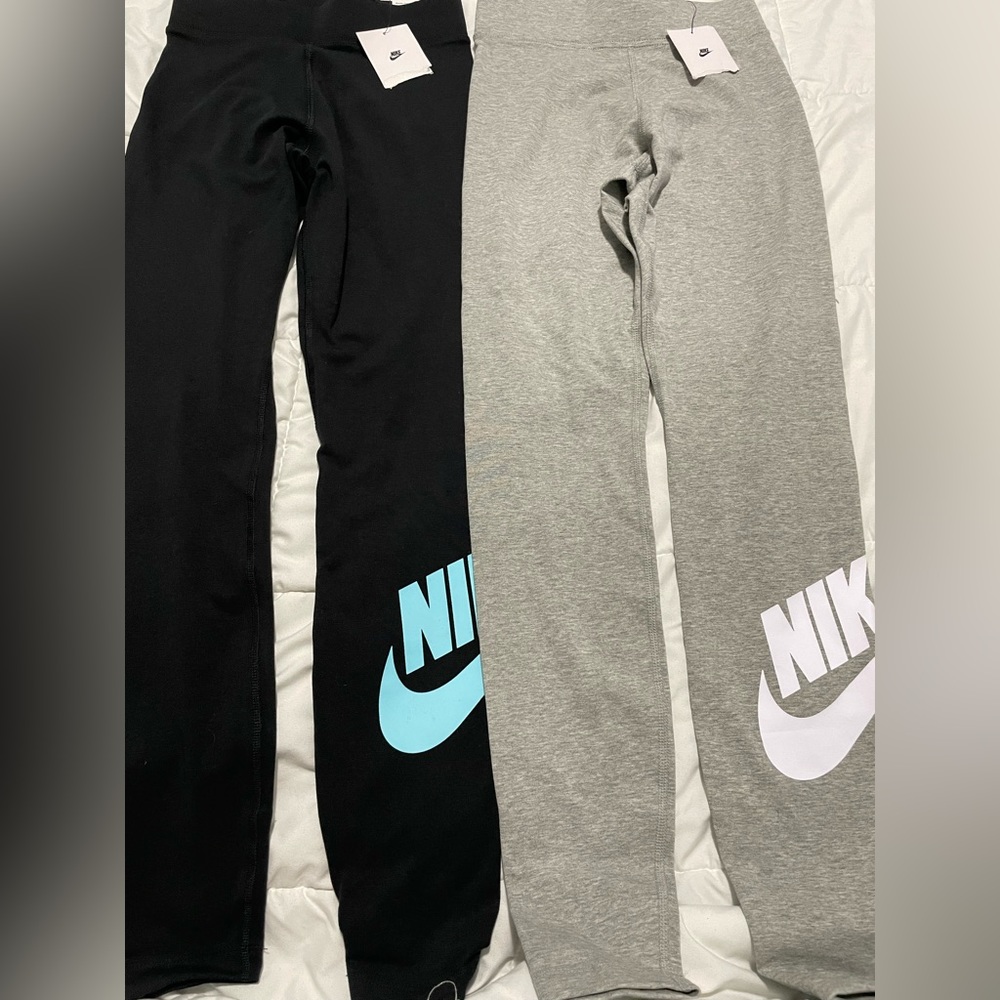 2 Pair Nike Sportswear
2 Pair Women's High-Waisted Logo Leggings XS- NWT